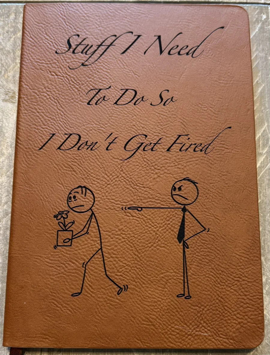 Brown leatherette notebook engraved with a custom illustration