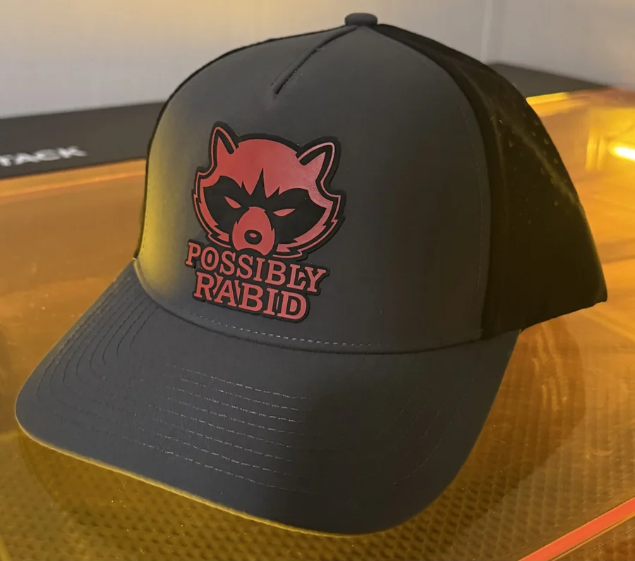 Black cap with a red Possibly Rabid custom patch