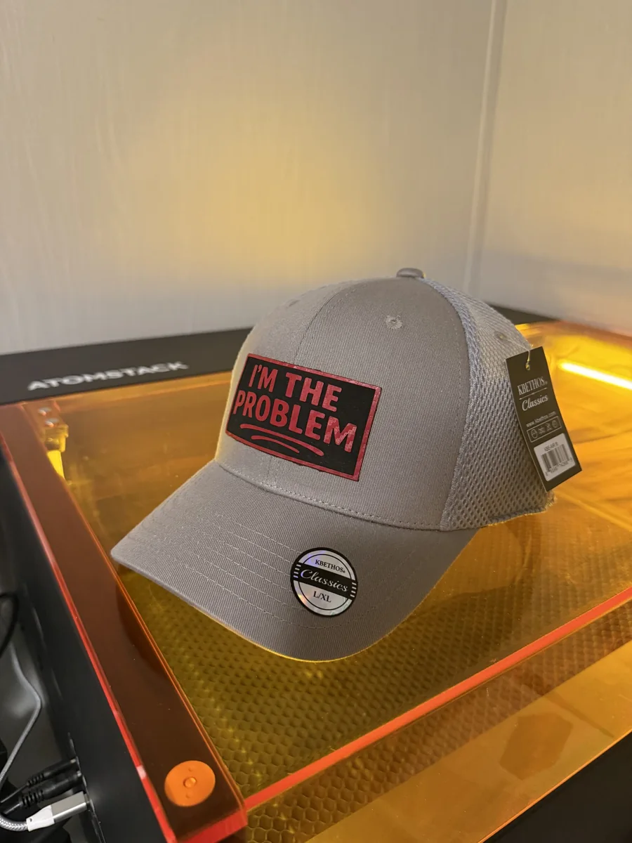 Gray cap with a red and black custom statement patch