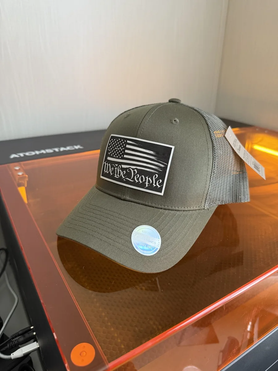 Gray cap with a black We the People flag patch